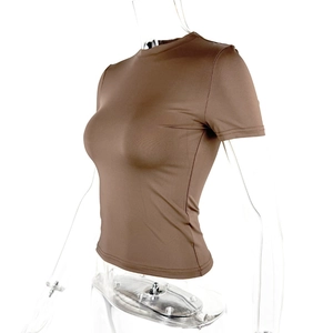 Detail view of the brown slim-fit t-shirt showing elastic knitted texture and round neck