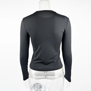Rear view of sleek black slim-fit long sleeve t-shirt with crew neck on white background