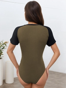 Slim fit ribbed bodysuit in olive green and black color block style with short sleeves