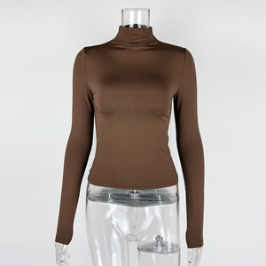Detail view of coffee brown long sleeve slim-fit turtleneck top with silky texture