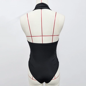 Detail of back view showing halter neck and open back on a black slim bodysuit
