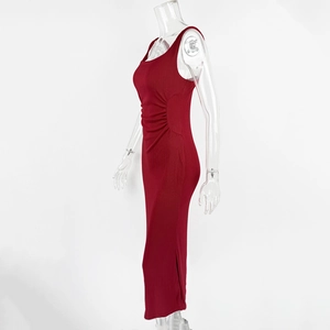 Detail view of red sleeveless ruched dress with ribbed knit texture and side shirring