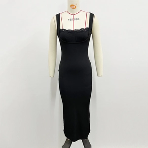 Detailed view of elegant black lace trim on the neckline of a slim fit maxi dress