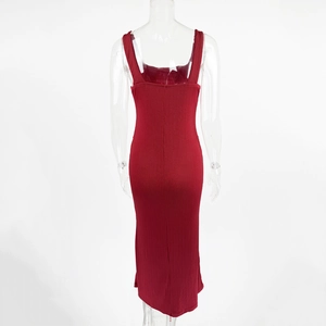 Detail of dark red ribbed knit maxi dress showing sleeveless back and fitted silhouette