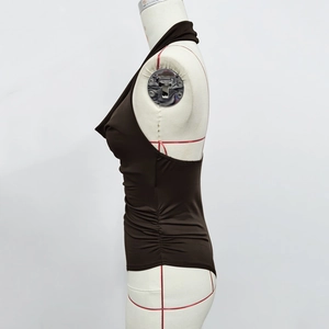 Detail of dark brown ruched bodysuit featuring halter neck and silky stretch fabric