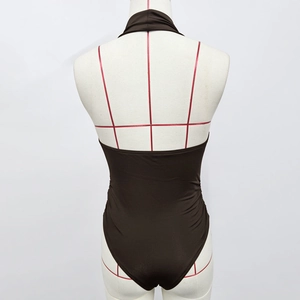 Detail of coffee brown halter neck bodysuit with open back and ruching on a mannequin