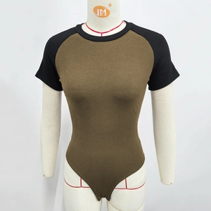 Detail of olive green ribbed knit bodysuit featuring black raglan sleeves and crew neck