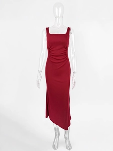 Slim fit dark red sleeveless knit dress with side ruching and asymmetrical hemline