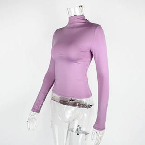 Detail of lavender mock neck long sleeve top showing slim fit cut and elastic knit fabric
