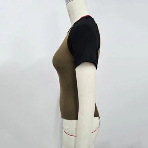 Detail of ribbed knit bodysuit showing brown and black contrast short sleeves and texture