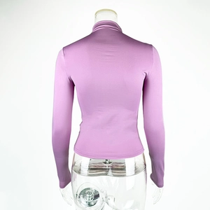 Detail view of the back of a slim fit lavender mock neck long sleeve top for women
