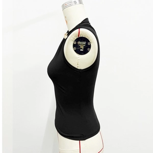 Detailed side view of black sleeveless top with metal ring accent and slim fit design