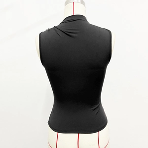 Close-up of sleek black sleeveless turtleneck top featuring premium elastic fabric texture