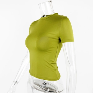Detailed side view of grass green slim fit crew neck T-shirt on a clear mannequin