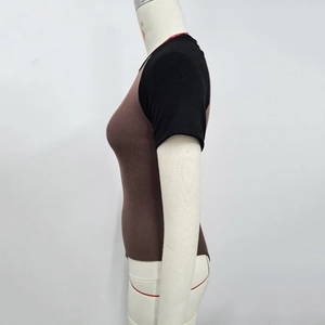 Detail view of ribbed color-block bodysuit with brown body and black short sleeves
