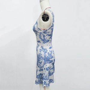 Detail of French Toile de Jouy print on a slim white sleeveless summer dress