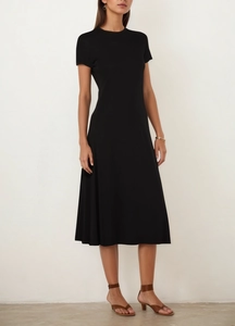 Close-up of black short sleeve midi dress featuring slim fit waist and A-line silhouette