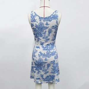 Back view of a backless floral mini dress with blue toile de jouy pattern and slim fit cut