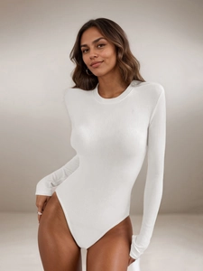 Close-up of white ribbed bodysuit showing soft elastic fabric texture and crew neck detail