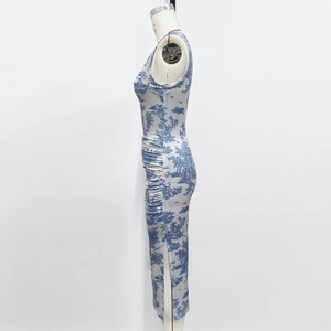 Detail of blue floral print sundress featuring side ruching and a slim fit slit hemline