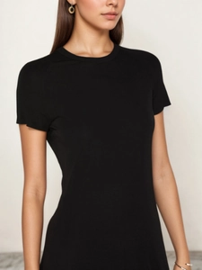 Detailed close-up of a women black slim fit crew neck short sleeve dress with soft fabric