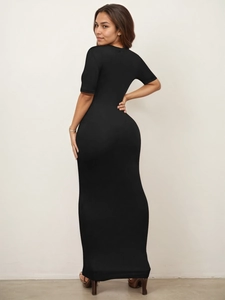 Rear view of a slim fit black maxi dress with short sleeves and high stretch fabric