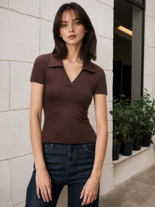 Detail of ribbed texture on brown slim-fit polo t-shirt with elegant V-neck and collar