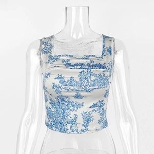 Detail of crop top featuring blue Toile de Jouy print and elegant square neckline