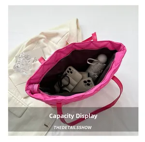 Interior view of large pink quilted tote bag showing ample space for daily essentials
