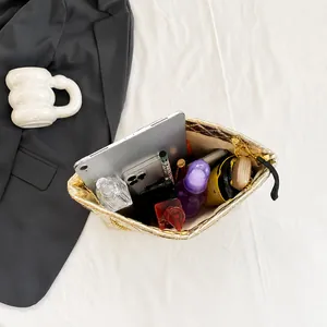 Macro view of gold quilted tote bag interior showing large capacity for iPad and makeup