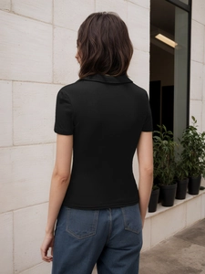 Slim fit black ribbed polo t-shirt for women shown from the back view with blue jeans
