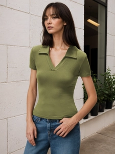 Close-up of grass green slim fit knit t-shirt with ribbed texture and polo collar