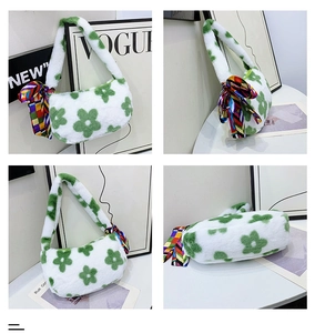 Detail view of plush flower handbag with green floral patterns and silk scarf handle