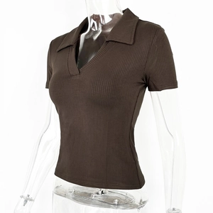 Detail of ribbed knit fabric on brown slim fit polo shirt with deep V-neckline