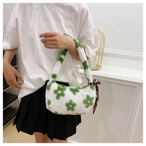 Detail of plush flower handbag in white faux fur with green floral pattern and silk scarf