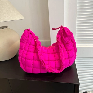 Fluorescent pink quilted shoulder bag with ruffles and puffy cloud texture style