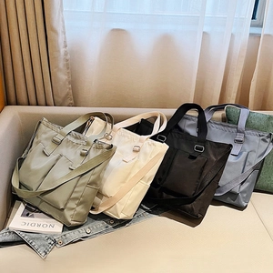 Minimalist nylon tote bags in four colors with adjustable straps for women and students