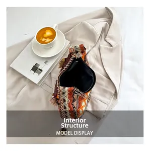 Internal structure of woven crescent bag with colorful geometric patterns and chain strap