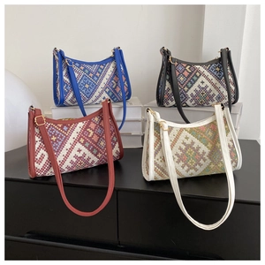 Detailed display of four ethnic woven shoulder bags in blue, black, red, and white colors