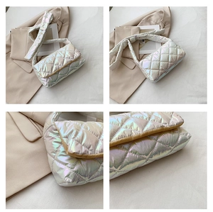 Detailed views of quilted holographic shoulder bag with shimmering laser finish and stitching