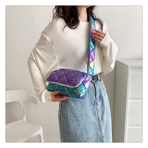 Close-up of holographic purple quilted puffer bag with wide strap and metallic finish