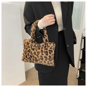 Chic leopard print plush handbag with soft faux fur texture and dual top handles