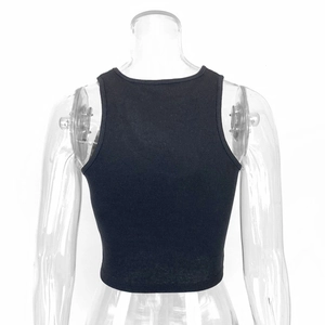 Detail view of the black ribbed knit fabric and racerback design on a slim-fit crop top