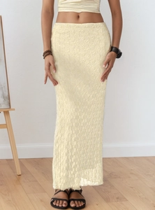 Detail of knitted hollow-out mesh pattern on this beige summer maxi skirt set