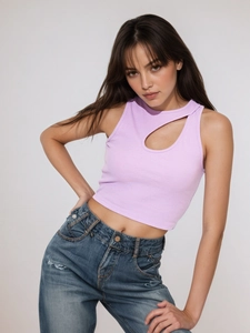 Lavender ribbed crop top with teardrop cutout paired with distressed denim jeans