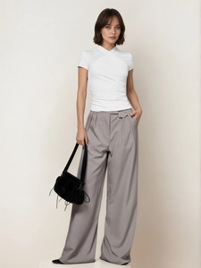 Women's minimalist white cross-neck slim t-shirt with grey wide-leg trousers outfit