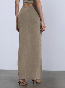Chic two-piece set featuring asymmetrical low-waist maxi skirt and crop top in earthy tones