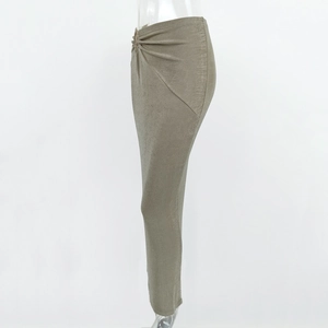 Detail of side ruching and twist on an asymmetrical olive green metallic finish skirt