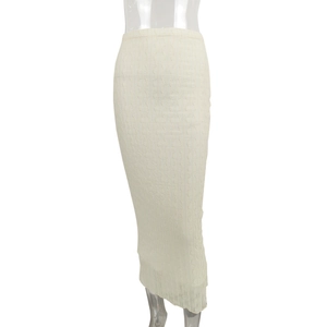 Detailed view of beige high waist mesh jacquard skirt with wavy knit texture
