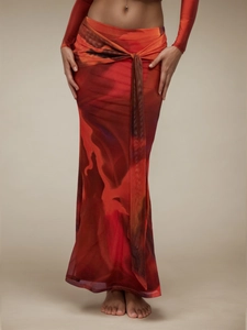 Elegante gonna lunga vintage con nodo in vita e motivo marmorizzato rosso-arancio